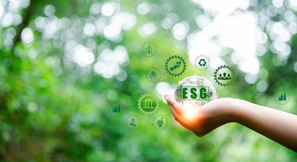 ESG icon concept in hand for environmental, social and governance in sustainable and ethical business on Network connection on green background. Ideas for production and conservation of environment.